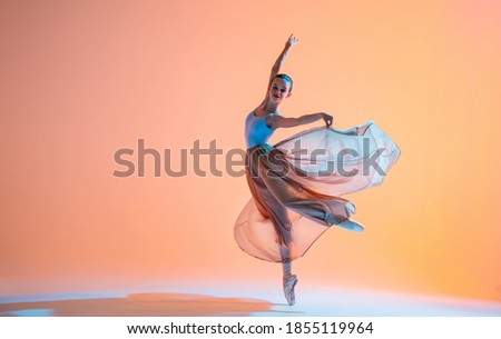 Similar – Image, Stock Photo Young slim ballerina jumping above ground in studio flexing legs.