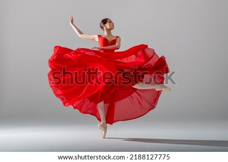 Similar – Image, Stock Photo Graceful ballerina and her male partner dancing elements of classical or modern ballet in dark with floodlight backlight. Couple in smoke on black background. Art concept.