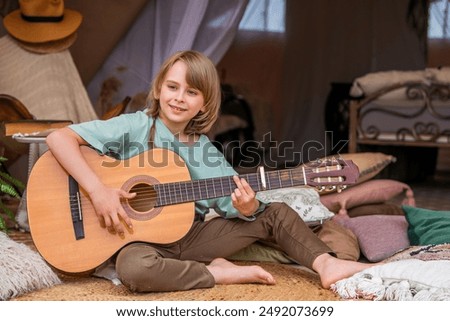 Similar – Image, Stock Photo Child playing guitar