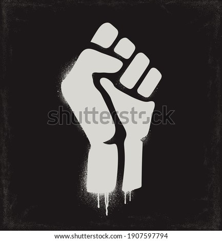 Fist raised in protest. Fist icon isolated on a dark background. Vector illustration