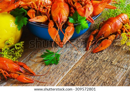 crawfish on wooden background in a plate
