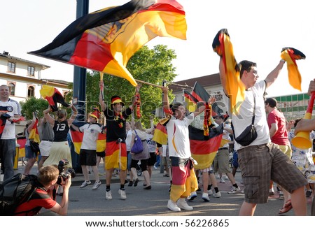 HEIDELBERG, GERMANY - JUNE 27 : German soccer fans celebrate Germany beat England at the world cup at the Adenauer Platz on June 27, 2010 in Heidelberg, Germany