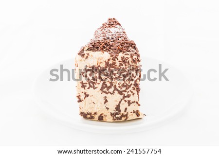 Chocolate cake slice with curl on white dish. white background