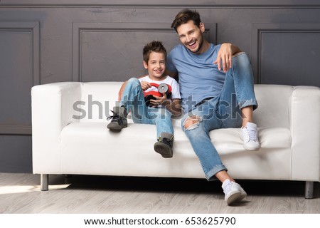 Similar – Image, Stock Photo Single father sitting on grass by the tree with little daughter