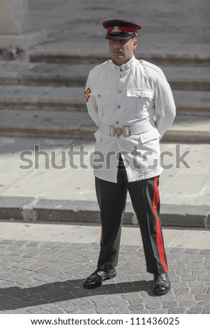VALLETTA, MALTA - AUG 25 - A soldier from the AFM stands at ease while awaiting dignitaries during the state funeral of former Prime Minister of Malta Dom Mintoff in Valletta on 25 August 2012
