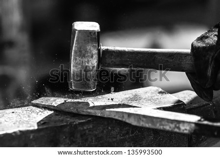 Detail shot of metal being worked at a blacksmith forge