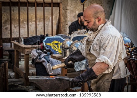 MDINA, MALTA - APR 13 : A medieval blacksmith forges steel during the Medieval Mdina festival in Mdina, Malta on April 13, 2013