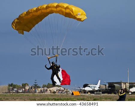 LUQA, MALTA - SEP 26 : Tigers FreeFall Parachute Team flies during the Malta International Airshow September 26, 2009 in Luqa, Malta.
