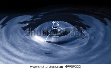 Water droplet frozen in action by off camera flash