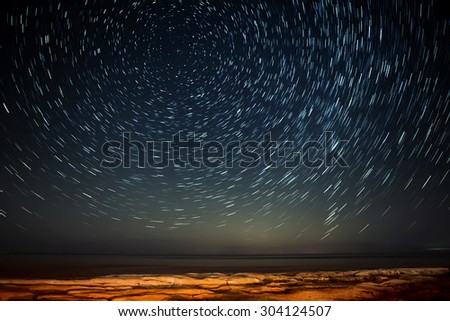 Extreme long exposure image showing star trails around the Polar Star or Polaris over Selmun in Malta