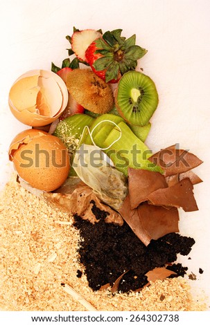 Organic waste over white background, used to make home compost, vertical image