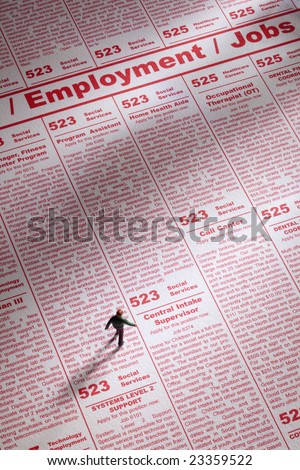 Toy person seeking job employment in newspaper ads