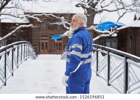 Similar – Foto Bild Mann räumt im Winter mit einer Schneefräse den Schnee beiseite