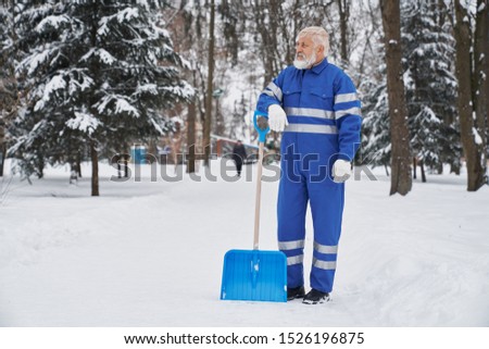 Similar – Foto Bild Mann räumt im Winter mit einer Schneefräse den Schnee beiseite