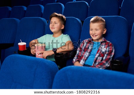 Image, Stock Photo Focused boy watching films on tablet