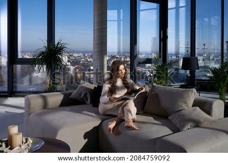 Similar – Image, Stock Photo Woman reading book near candles