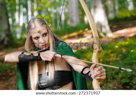 female elf with a bow in the forest