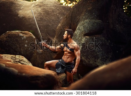 spartan on the background of rocky mountains, warrior, fighter, holding raised sword in his right hand, athletic body, spartan looks at a raised sword