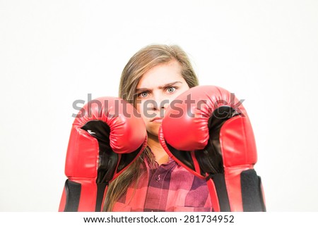Teenage girl is ready to fight with the world. White background.