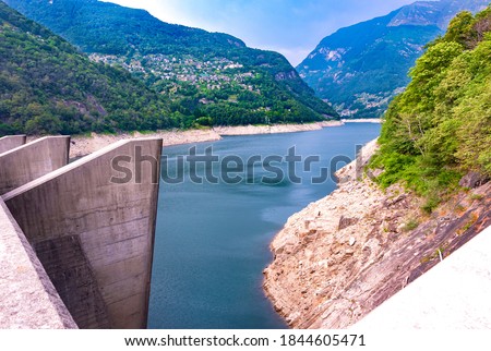 Europe.Switzerland.Dam on the Verzasca River.Valley of Verzasca surrounded by the Alps.Crystal clear water.