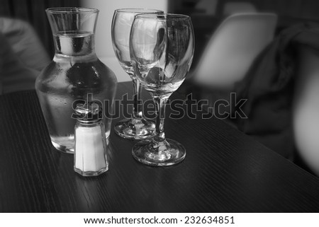 Carafe of water and two glasses.  Indoor shot using natural light.