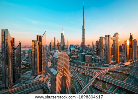 Dubai city center and Sheikh Zayed bussy intersection before  sunset with colorful sky, United Arab Emirates
