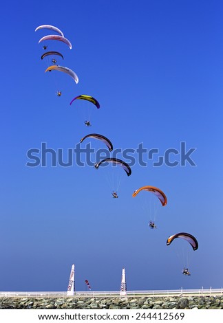 JUMEIRAH BEACH,UNITED ARAB EMIRATES-DECEMBER 2, 2013: Group of sky divers falling from the sky in Dubai,United Arab Emirates