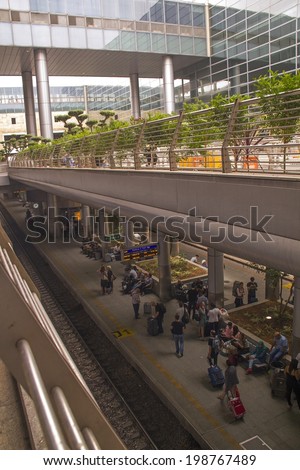 TEL AVIV, ISRAEL JUNE 5: Travelers wait for train from Airport on June 5, 2014 in Tel Aviv. The contemporary railway station runs north and south of Israel. It opened in 2004.