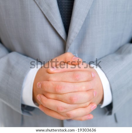 Close up of middle aged business man with fused fingers