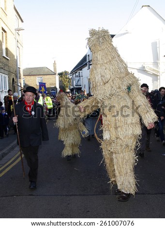 A man dressed in  traditional costume made of straw parades through the streets at the annual Straw Bear Festival, Whittlesey, UK. taken 14/01/2012