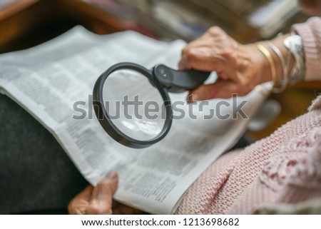 Similar – Image, Stock Photo Senior woman with magnifying glass