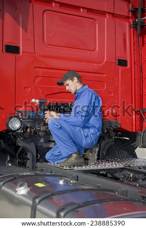 mechanics working on truck