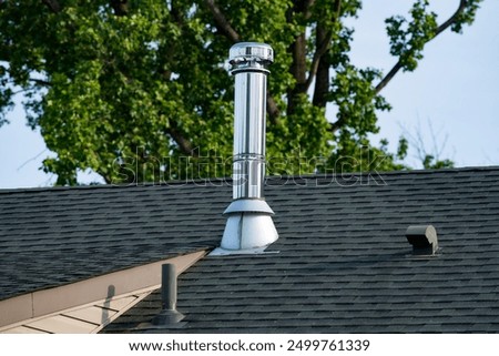 Similar – Image, Stock Photo The exhaust air chimney shines only externally in front of the dirty facade