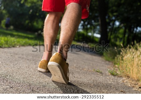 man shoes running on the asphalt