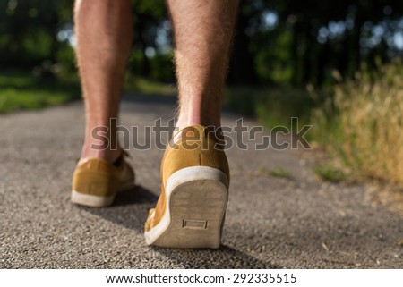 man shoes running on the asphalt