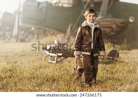 Young Aviator parked aircraft at the airport autumn day