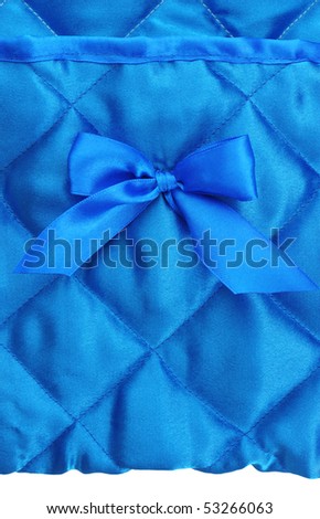 Blue silk background with a bow