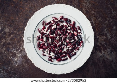 Dried Kidney Haricot Purple Beans On White Plate Top View