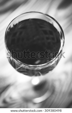 glass of red wine black and white