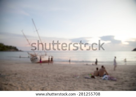 People seaside Evening seaside beach ,boat capsized. ,blur background