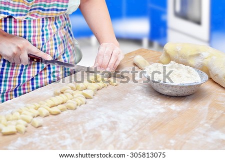 italian woman making homemade fresh pasta