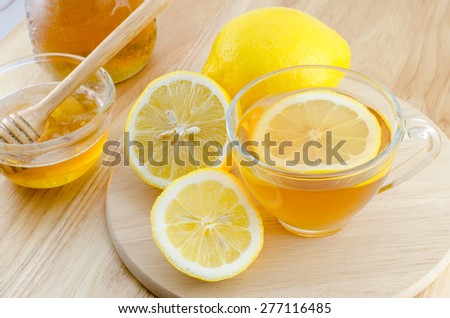 Honey lemon tea on wooden table
