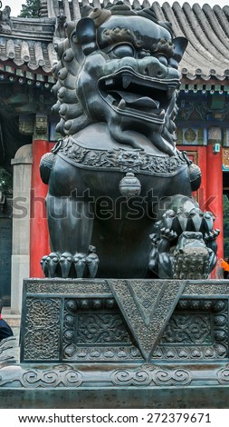 China, Beijing . Summer emperor Palace . Figures of mythical creatures at the entrances to the building. Bronze lion - dog guard at the entrance of Pavilion Goodwill and longevity.