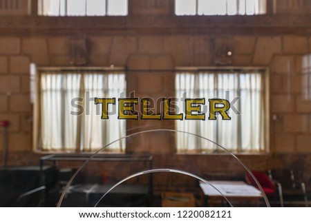 Old fashioned bank teller window sign in a classically styled building. 商業照片 © 