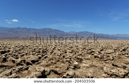 The rough ground and salt crystals which form the unusual geology of the Devil\'s Golf Course in Death Valley.
