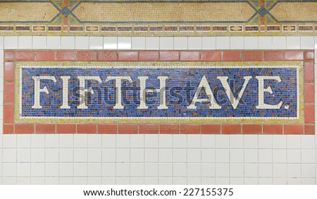 NEW YORK, NEW YORK - OCTOBER 27, 2014: Classic mosaic tile of the Fifth Avenue Subway Station, New York.