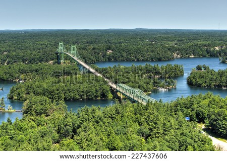 THOUSAND ISLANDS, ONTARIO - JULY 5, 2014: The Thousand Islands Bridge. An international bridge system constructed in 1937 over Saint Lawrence River connecting New York with Canada.