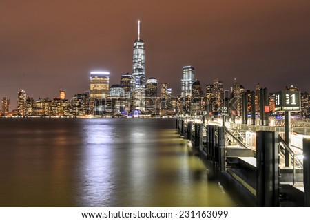 JERSEY CITY, NEW JERSEY - NOVEMBER 8, 2014: New York City Manhattan skyline at night over Hudson River viewed from New Jersey