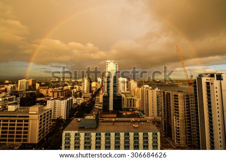 Perth, Australia Skyline at sunset looking westward with a rainbow in the distance.