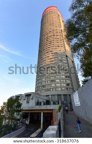 Johannesburg, South Africa - May 25, 2015: Entrance to Ponte City Building at sunset. Ponte City is a famous skyscraper in the Hillbrow neighbourhood of Johannesburg.